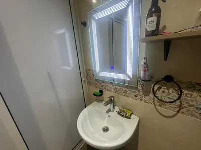 a small bathroom with a sink and a window at Cozy Rabat Studio near Tram & City Center in Rabat