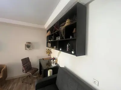 a living room with a couch and a chair at Cozy Rabat Studio near Tram & City Center in Rabat