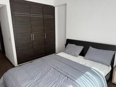 a large bed in a bedroom with a large closet at Urban Square in Casablanca