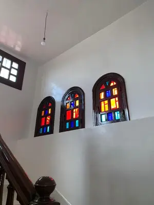 three stained glass windows in a room with stairs at Grand Andalusian Villa Private Garage and Garden in Casablanca