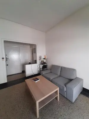a living room with a couch and a coffee table at Cozy Studio with Balcony, Casa Center Close to Everything in Casablanca