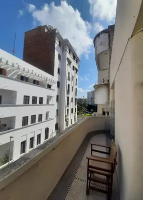 a bench on the balcony of a building at Cozy Studio with Balcony, Casa Center Close to Everything in Casablanca