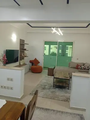 a living room with a couch and a table at Oceania in Mohammedia