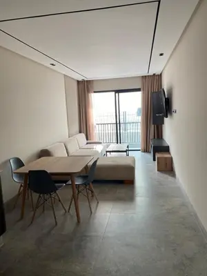 a living room with a couch and a table at CFC centre d'affaires - Salle de sport - Wifi in Casablanca