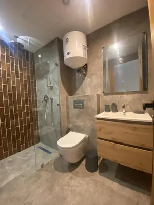a bathroom with a toilet and a shower and a sink at CFC centre d'affaires - Salle de sport - Wifi in Casablanca