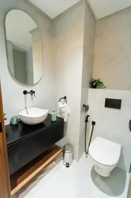 a bathroom with a sink and a toilet at Elegant Studio at 2 Mars Modern, Quiet Convenient in Casablanca