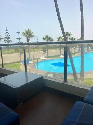 a view of a swimming pool from a hotel room at Casablanca !Tamaris! 2 bedrooms! Pool & Sea View! in Dar Sidi Slimane