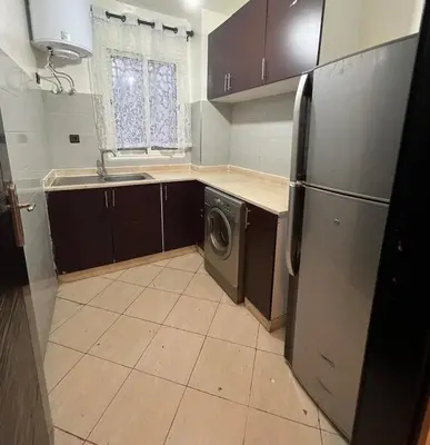 a kitchen with a refrigerator and a washing machine at 2 Bedrooms 3 beds and a living room in Dar Bouazza in Dar Ben Abdallah Ben Dehbi