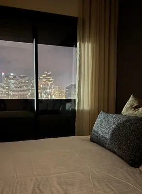 a bedroom with a window with a view of a city at Bridge Collection - Argana in Casablanca
