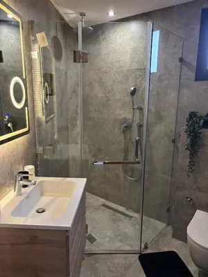 a bathroom with a shower and a sink at Bridge Collection - Argana in Casablanca