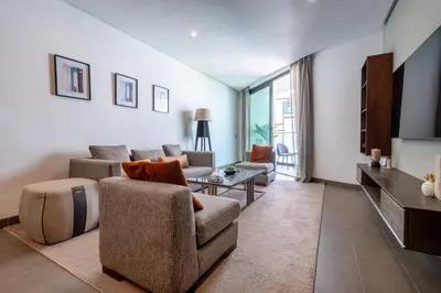 a living room with two couches and a tv at Luxury Apartment Anfaplace Cosy & Design in Casablanca