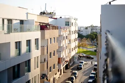 a city street with cars parked on the side of a building at Appartement luxueux &chaleureux au cœur de Rabat in Rabat