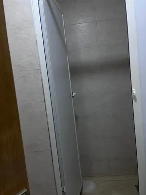 a shower stall with a door in a bathroom at Havre de paix in Rabat