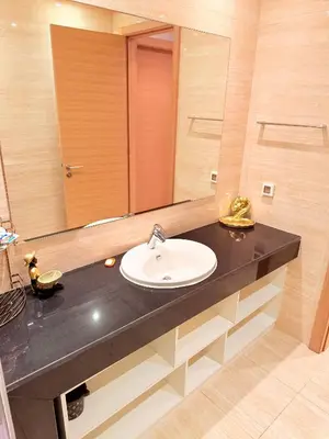 a bathroom with a sink and a mirror at Prestigia Golf City Bouskoura in Bouskoura