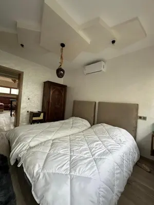a bedroom with a large white bed in a room at Chez Abir in Rabat