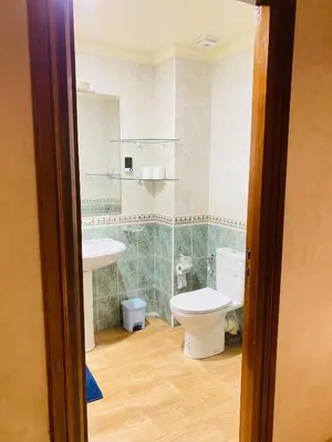 a bathroom with a toilet and a sink at Elegant cultural 2-bedroom apartment in central Casablanca in Casablanca