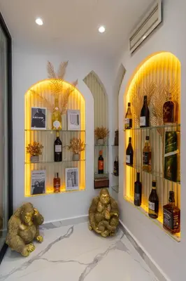 a room with two shelves with bottles of wine at Casablanca Luxury Penthouse with Jacuzzi & Views in Casablanca