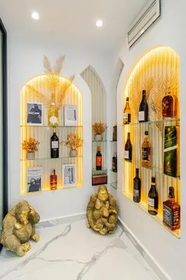 a room with two shelves of wine bottles at Casablanca Luxury Penthouse with Jacuzzi & Views in Casablanca