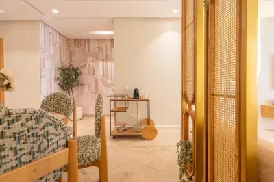 a bedroom with a bed and chairs in a room at LuxArt Casablanca in Casablanca