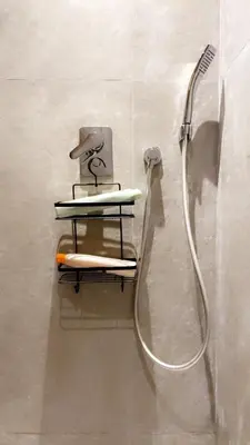 a shower in a bathroom with a shower head at Les princesses studio confortable in Maarif