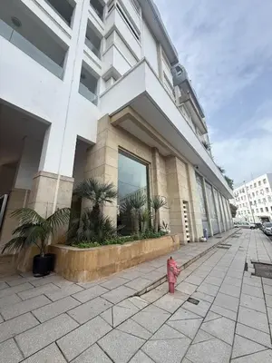 a red fire hydrant in front of a building at Luxury Duplex with Home Cinema Central Casablanca in Casablanca