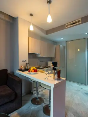 a kitchen with a counter with wine glasses on it at The Fourteen Luxury Boutique Hotel & SPA in Casablanca