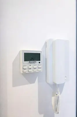 a phone is attached to a white wall at Studio design et cosy au centre ville in Casablanca