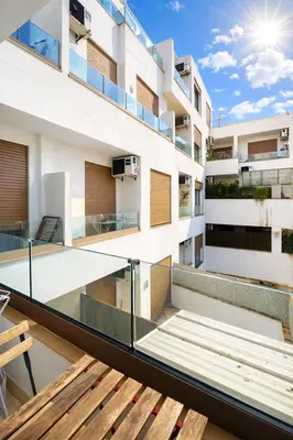 a balcony of a building with a wooden bench at Studio design et cosy au centre ville in Casablanca