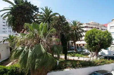 a view of a city with palm trees and buildings at Central Downtown Free Parcking AC in Casablanca