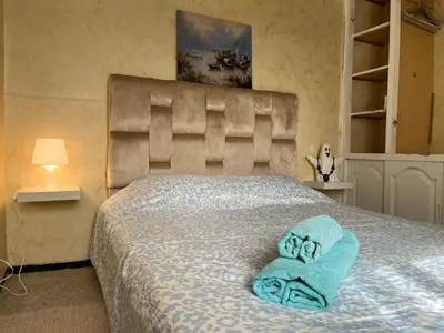 a bedroom with a bed with towels on it at Chambre Cosy - Accès Côte et Plage Mohammedia, Centre-Ville Mohammedia à Pied - Résidence 3 Mars in Mohammedia