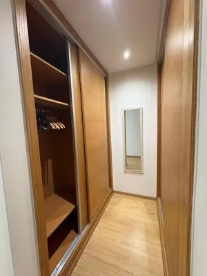 a hallway with a door to a closet at Premium 2 Bedroom Suite Maarif Central & High-Speed Wi-Fi Fully Equipped Walk to Twin Center & Shops Next to Carrefour Val Fleuri Family-Friendly in Casablanca