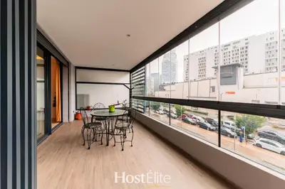 a balcony with a table and chairs in a building at CFC Elegance & Terrace & Fitness & Parking in Casablanca