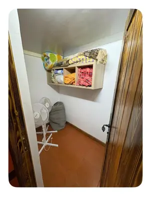 a small room with a closet and a door at La Hacienda De Morafia in Bouskoura