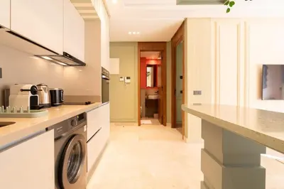 a kitchen with a washer and dryer at Résidence Terre de Lys in Casablanca