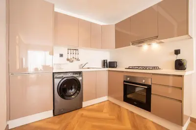 a kitchen with a washer and a dishwasher at Studio chic & moderne - Les Princesses - Parking in Casablanca