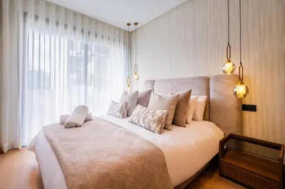 a large bed in a room with a large window at Studio chic & moderne - Les Princesses - Parking in Casablanca