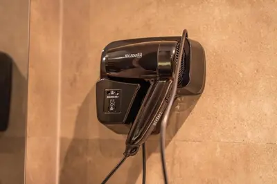 a hair dryer on a wall in a room at Résidence Happy Living in Casablanca