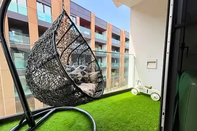 a hammock on the balcony of a building at Maya Suites - Anfa Place - Sea View in Casablanca