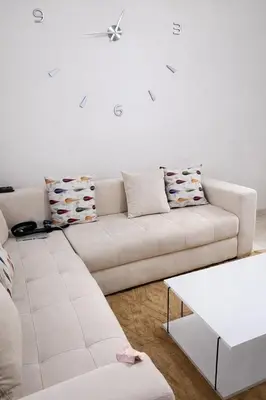 a white living room with a white couch at Appart luxe in Rabat