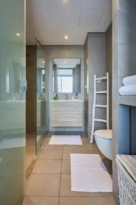 a bathroom with a shower and a toilet and a sink at Bright Studio at Bliving with Sunny Terrace 1 BR in Casablanca