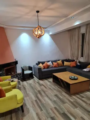 a living room with a couch and a coffee table at Adnan in Temara