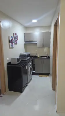 a kitchen with a stove and a washer and dryer at Casa Downtown Modern Studio in Casablanca