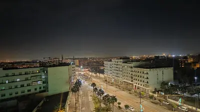 a view of a city at night with buildings at Casa Downtown Modern Studio in Casablanca