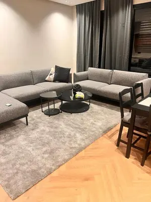 a living room with a couch and tables at Apartment for rent in the heart of Casablanca in Maarif