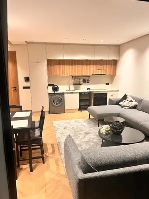 a living room with a couch and a table at Apartment for rent in the heart of Casablanca in Maarif