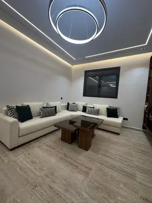 a living room with a couch and a table at Apartment Témara Ideal Center High Standing in Temara