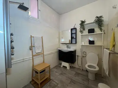 a bathroom with a toilet and a sink at Villa Cosy aux Sablettes, plage à deux pas in Mohammedia
