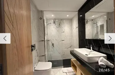 a bathroom with a toilet and a sink and a shower at CMN airport apartment in Nouaseur