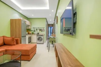 a living room with a couch and a table at Premium Stay Near Aeria Mall CFC- Feels like Home in Casablanca