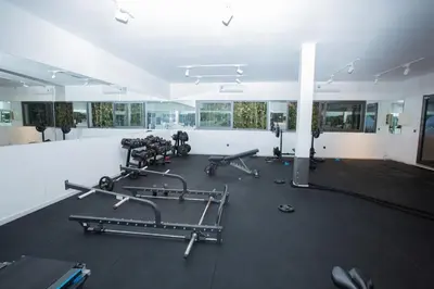 a gym with several treadmills and machines in a room at Neon Terrace in 12th Floor CFC Casablanca in Casablanca